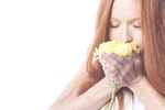 Woman holding flower uid 1343055.jpg
