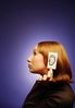 Woman holding paper ear to the side of her head.jpg