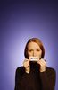 Woman holding paper frown to her face uid 1173071.jpg