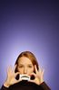 Woman holding paper frown to her face.jpg