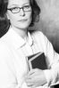 Woman in eyeglasses holding books 1.jpg