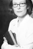 Woman in eyeglasses holding books 2.jpg