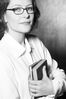 Woman in eyeglasses holding books.jpg