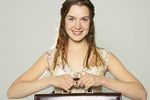 Woman in floral top holding leather case a82.jpg