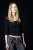 Woman in front of black background uid 1426760.jpg