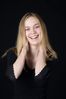 Woman in front of black background uid 1426769.jpg