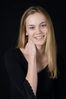 Woman in front of black background uid 1426778.jpg