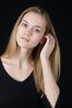 Woman in front of black background uid 1426780.jpg