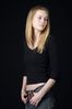 Woman in front of black background uid 1426787.jpg