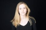 Woman in front of black background uid 1426796.jpg