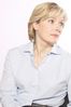 Woman in light blue shirt looking off to the side.jpg