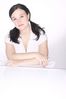 Woman leaning against glass table.jpg
