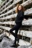 Woman leaning against wooden ladder.jpg