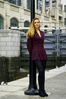 Woman leaning on light pole.jpg