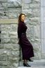 Woman leaning on stone post.jpg