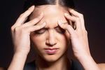 Woman massaging forehead uid 1426316.jpg