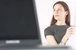 Woman reading newspaper at her desk 7.jpg