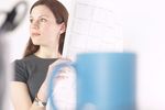 Woman reading newspaper at her desk 8.jpg