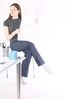 Woman sitting and reading newspaper at desk 1.jpg