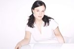 Woman sitting at glass table.jpg