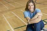 Woman sitting in gymnasium.jpg