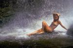 Woman sitting in waterfall spray.jpg