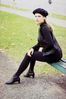 Woman sitting on corner of bench.jpg