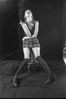 Woman smoking cigarette on stool.jpg