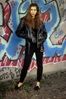 Woman standing against graffiti.jpg