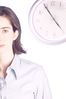 Woman standing in front of clock.jpg