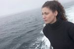 Woman standing on edge of boat.jpg