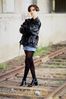 Woman standing on railroad tracks.jpg