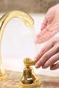 Woman testing bath water temperature 2.jpg