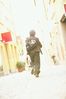 Woman walking away on a sidewalk uid 1455042.jpg