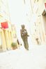 Woman walking away on a sidewalk.jpg