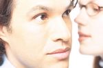 Woman whispering secret into man ear 2 c103124.jpg