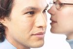Woman whispering secret into man ear 3 c103125.jpg