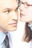 Woman whispering secret into man ear.jpg