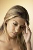Woman with a headache uid 1284153.jpg