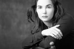 Woman with lip ring sitting in wooden chair 1.jpg