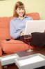 Woman working on laptop and drinking red wine.jpg