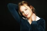 Young blonde woman with a black background uid 1452727.jpg