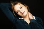 Young blonde woman with a black background uid 1453107.jpg