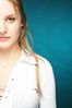Young blonde woman with a blue background uid 1453103.jpg