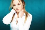 Young blonde woman with a blue background uid 1453113.jpg