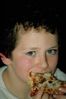 Young boy eating pizza.jpg