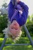 Young child hanging from pole.jpg