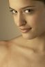Young woman in close up smiling seductively.jpg