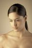 Young woman with downcast eyes.jpg